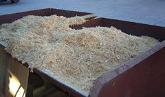 Image of two vats of wood shavings for mulch