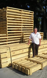 Fred Haman with Several Different Crates and Shipping Platforms